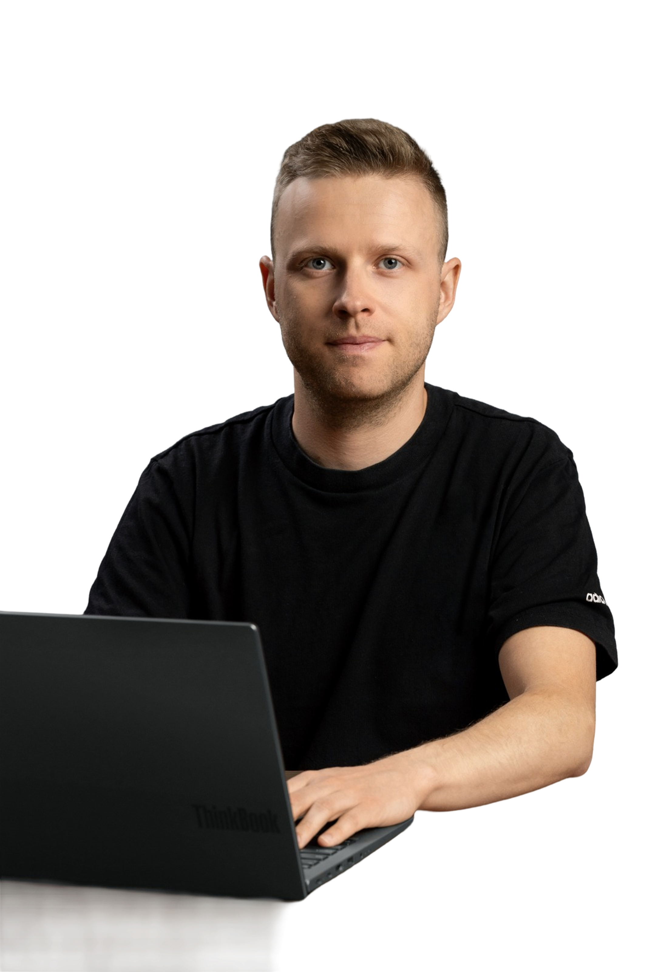 Paweł Żebrowski, founder of PDI Automation, at his laptop